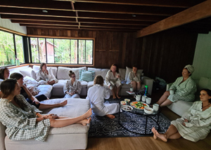 Group of people on couch inside cabin