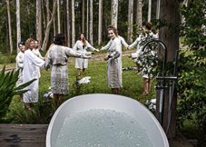 Group of people next to outdoor bath